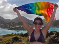 Paula celebrates reaching the peak of Pinel Island! It&#39;s a grueling rise of about 12 m. Grueling if you&#39;re wearing flip-flops and carrying snorkel gear that you never did get around to using!
